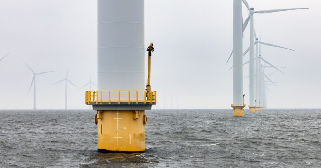 Offshore windfarm near Dutch coast with cloudy sky